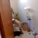 Someone video-records an unsuspecting blonde girl sitting on a toilet using her iPad device. No pooping sounds. Video is brief.